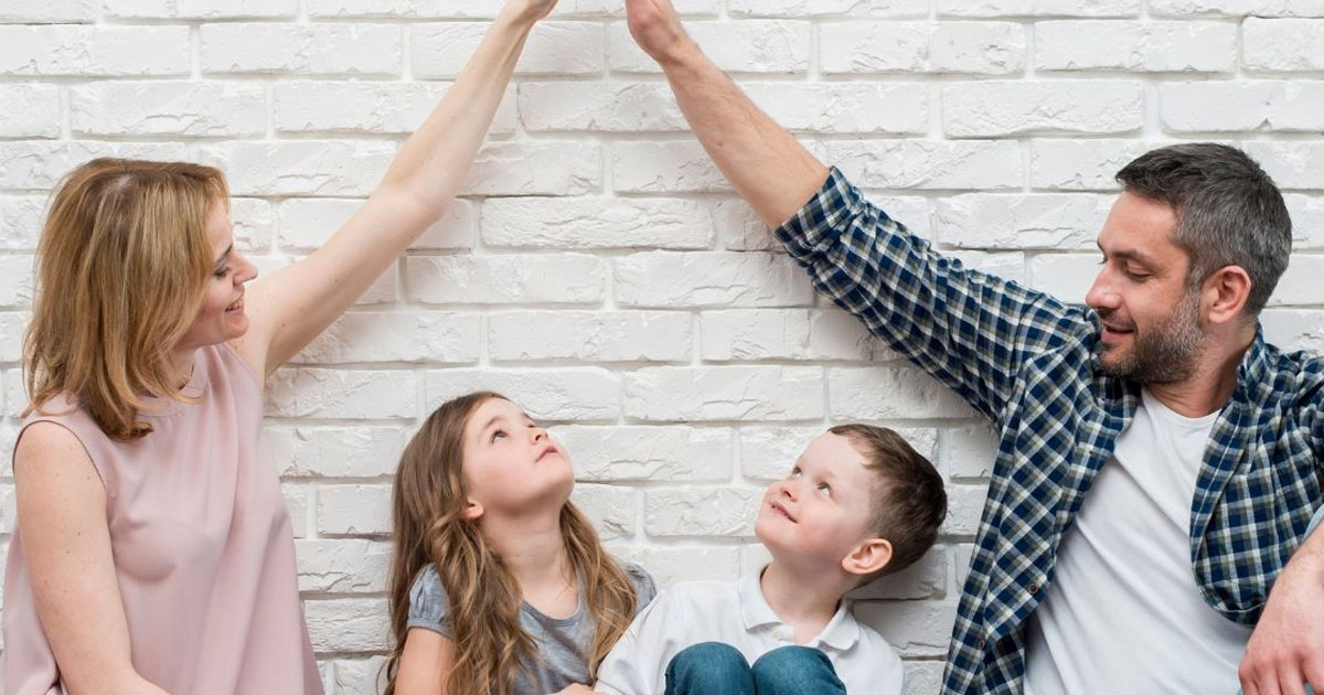 Family on a wall playing
