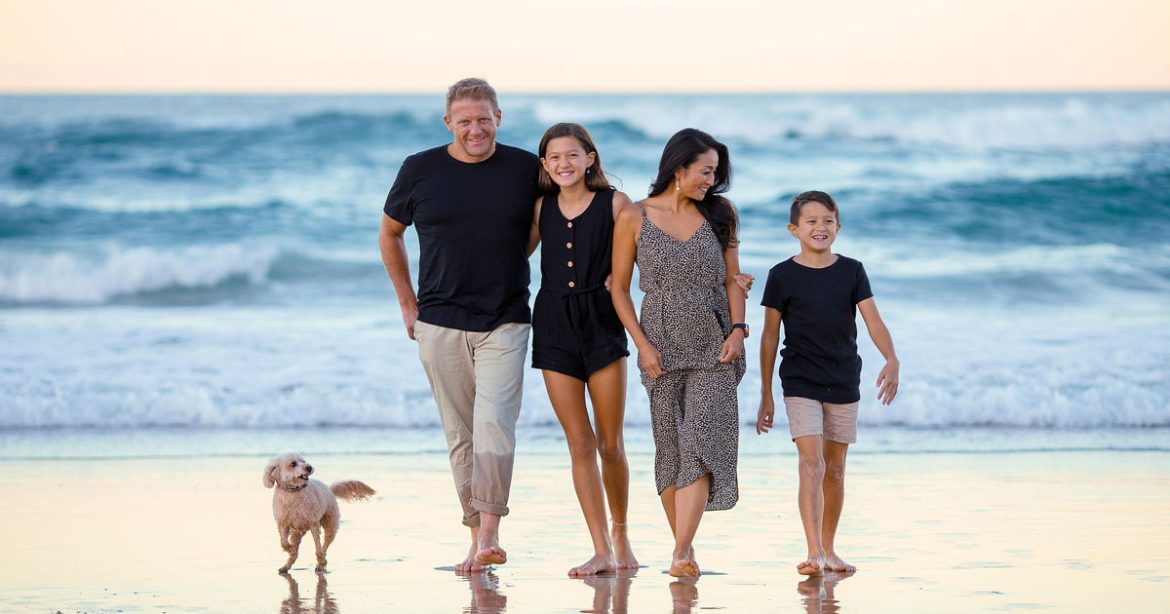 Family walking by the sea
