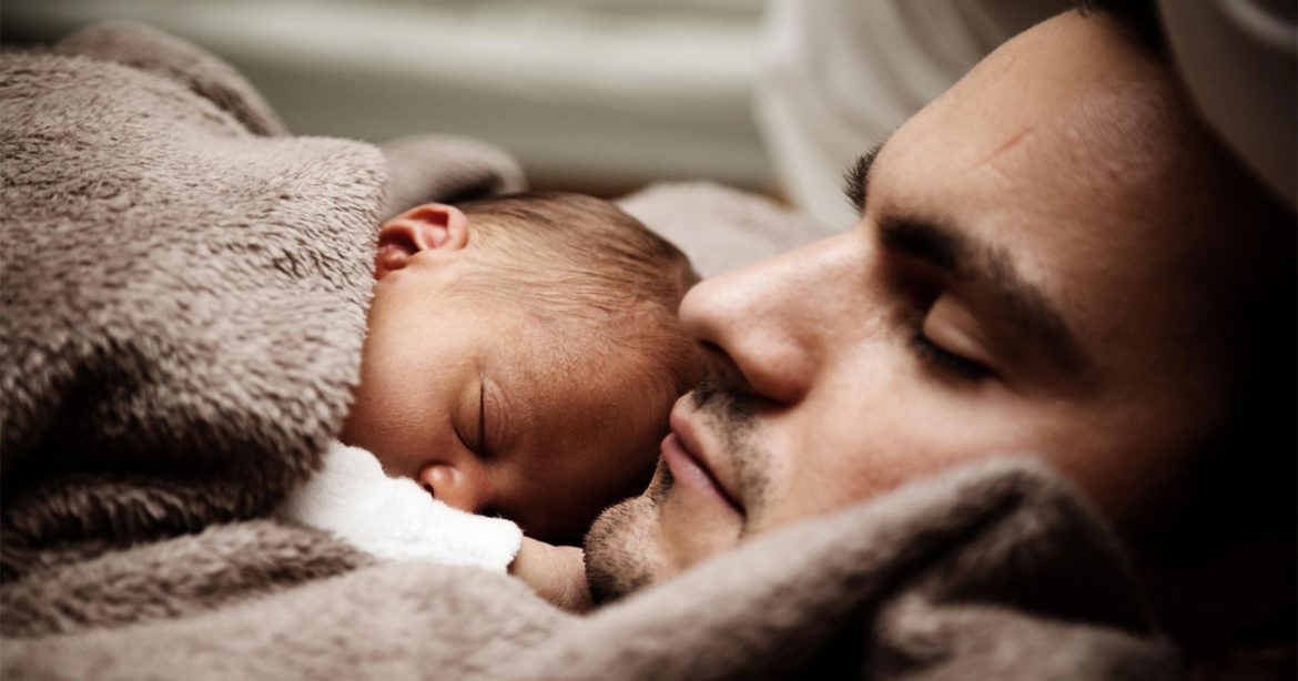 father and baby sleeping