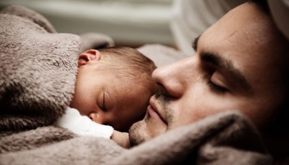 father and baby sleeping